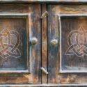 Old ornate armoire needing refinishing.