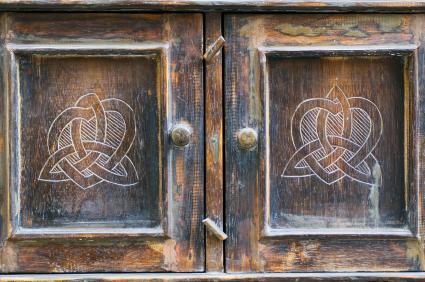 Old ornate armoire needing refinishing.