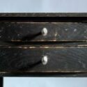 Chamfered small black end table.