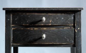 Chamfered small black end table.