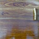 Creating a faux good grain using a graining rocking tool and wood stain.