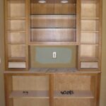 Doors and drawer fronts removed from cabinet, ready for new stain and finish.