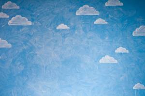 Modestly painted clouds on blue background.