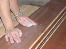 Using a sanding sponge between coats. Always lightly sand between each coat of clear wood finish.