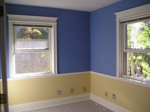 Office paint in a 2-tome wall color scheme. White ceiling and trim.