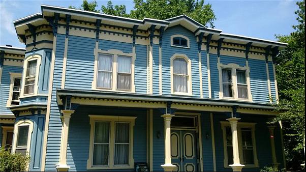 Ornately painted Victorian home's exterior.