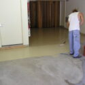 Painting a garage floor with 2-part epoxy.