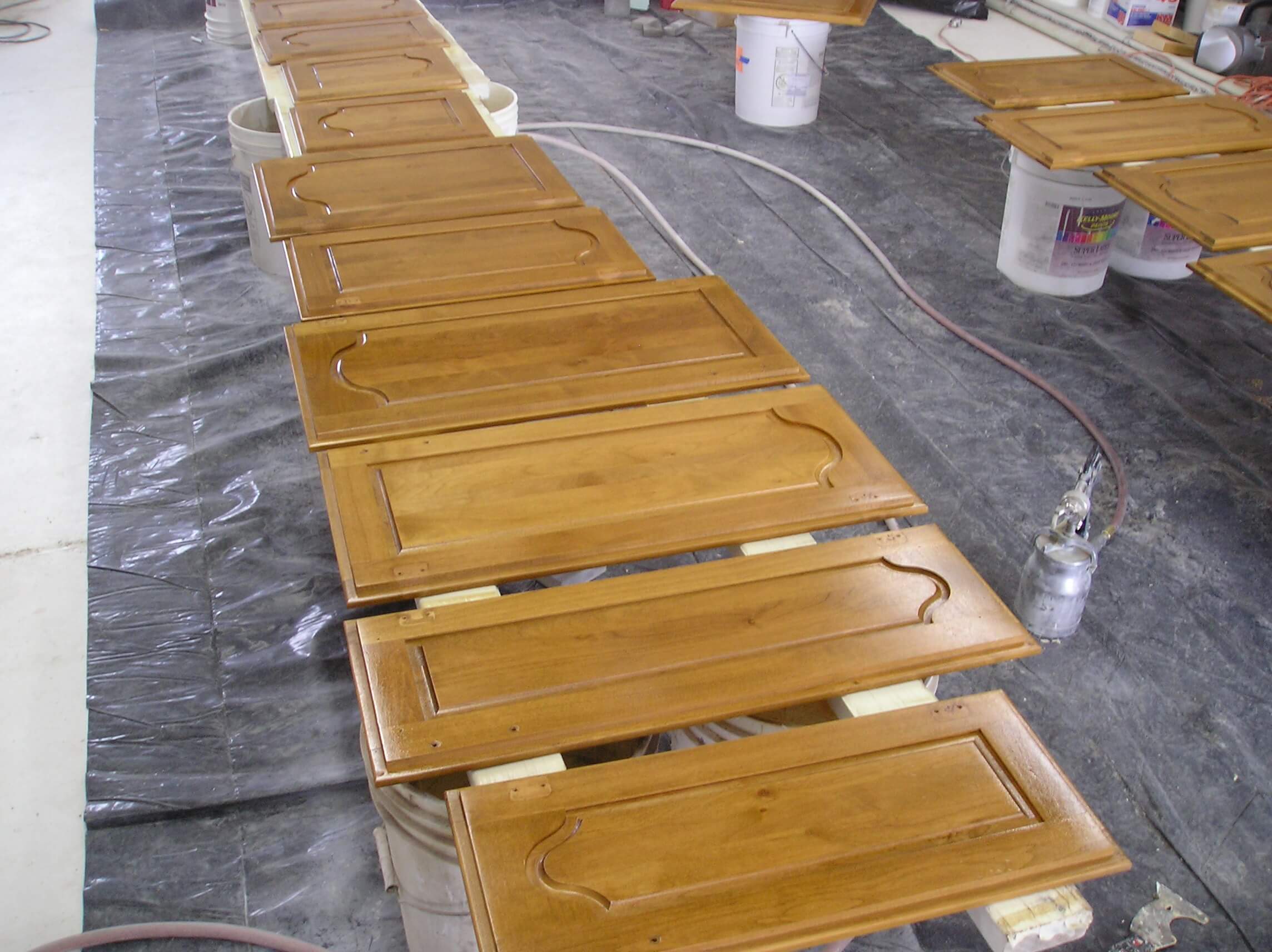 Staining and sealing maple kitchen cabinets.