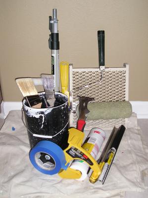 A basic painting kit with all the tools needed for house painting.