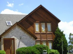 Cedar siding stained with exterior semi-transparent wood stain. 