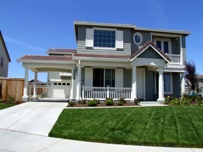 Outside view of a well cared for traditional home.