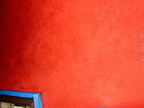 Glaze a mixed with red paint applied to a wall.