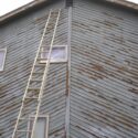 Cedar lap siding with peeling paint.