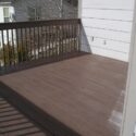 A semi-solid deck stain applied to a pressure treated wood deck floor and handrail.