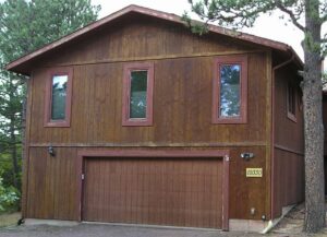 House with T1-11 siding washed and ready for a coat of exterior wood stain.