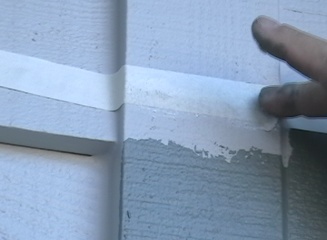 Spackling the tape edge to get a painted straight clean line between two paint colors.