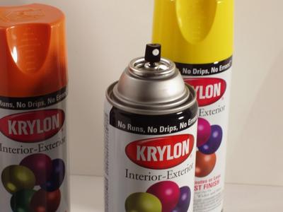 Three cans of Krylon spray paint.