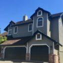 A beautifully painted multi-story stucco house.