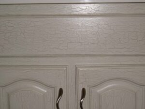 Close-up of a vanity with applied and sealed crackle paint finish.