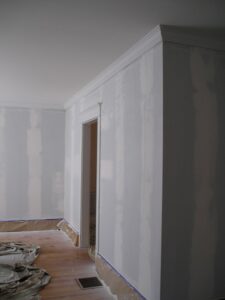 Walls primed, patched and readied for painting after removing wallpaper.