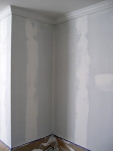 Wall patched, skimmed and readied for paint after stripping wallpaper.