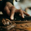 A craftsman repairing a piece of furniture.