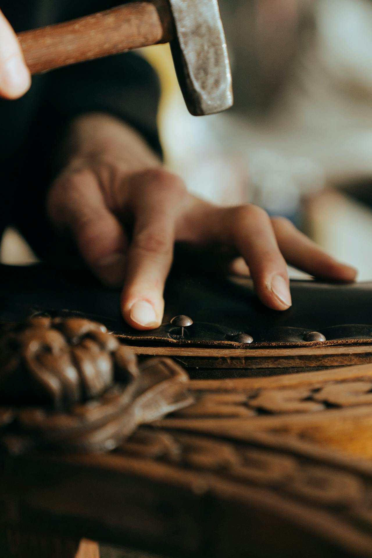 A craftsman repairing a piece of furniture.