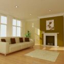 A simple modern living space painted with neutral white and an accent wall.