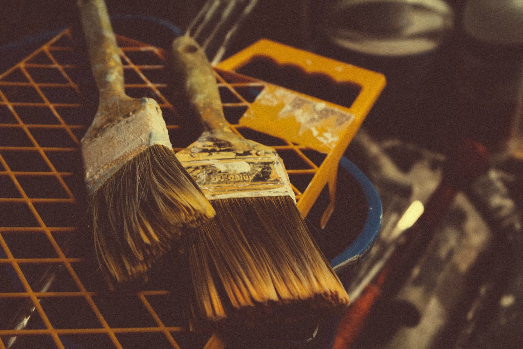 A pair of old paint brushes.