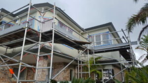 Scaffolding erected around a house.