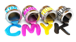 Bottles of ink in cmyk colors. Paint is poured from a can. Isolated on white background. 3d render